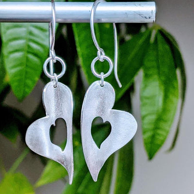  MELTED HEART CHAKRA EARRINGS | <Z-FIRE.COM> .999 Fine Silver Hearts .925 Sterling Silver Wires 0.5" Wide 1cm Wide 2.25" Total Length 5.75 cm Total Length Free Astrological Report of Choice Free Standard Shipping Hassle Free Returns Each piece is handcrafted and will differ slightly from piece to piece and will sometimes need a lead time of up to a week.