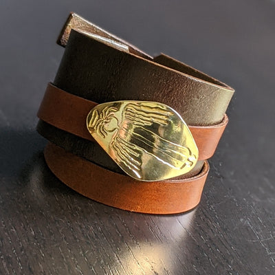LEATHER BRACELET WITH REMOVABLE ANGEL AMULET - BROWN/TAN | < Z-FIRE.COM > Leather Bracelet  Removable .999 Fine Silver Silver Amulet 24K Gold Plated  1.5" Dark Brown leather bracelet, with a 0.6"  Tan wrap-around leather strap 
