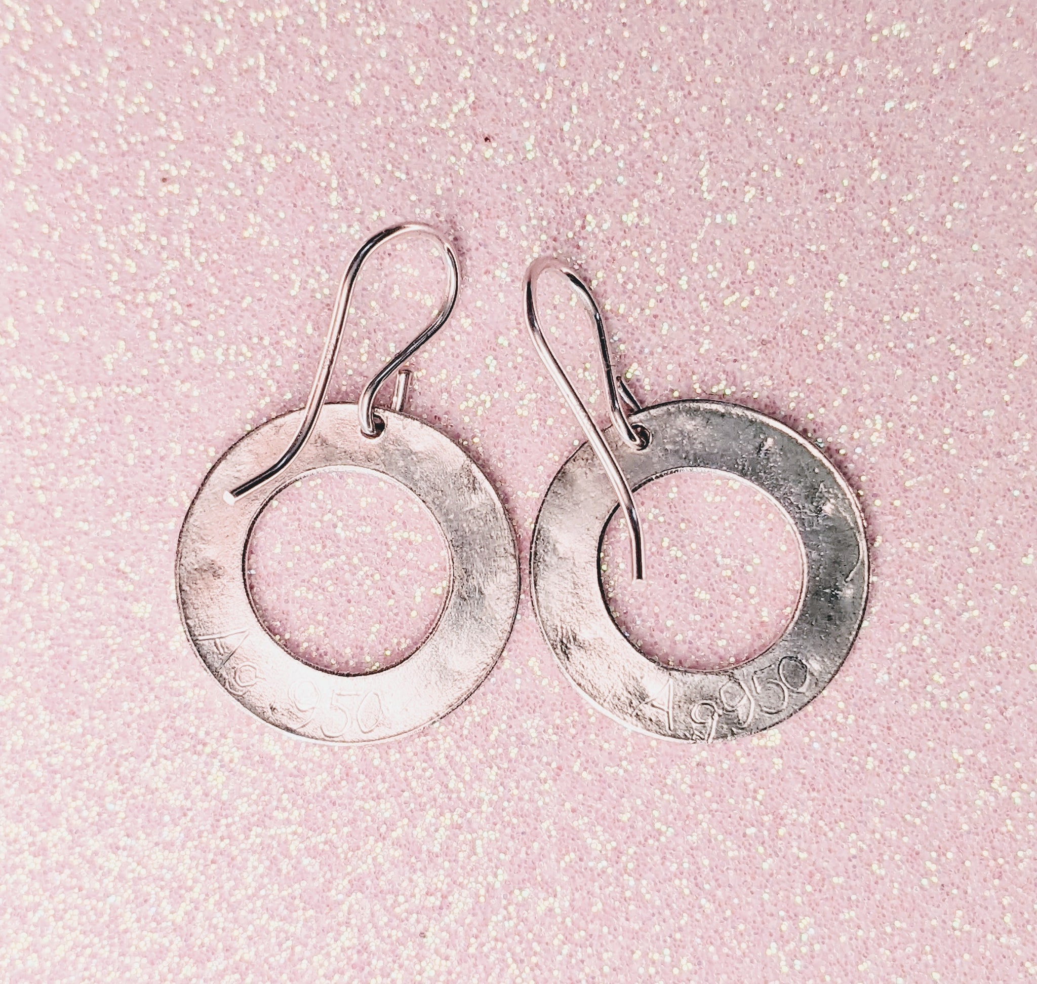 RING OF HEARTS EARRINGS | < Z-FIRE.COM > Tiny hearts are highlighted and polished on flat silver rings with a frosted background and highlighted and polished edges. .950 Fine Silver Rings About 11/16" Diameter About 18 mm Diameter .925 Sterling Silver Ear Wires