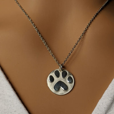 FINE SILVER PAW-PRINT CHARM WITH STAINLESS STEEL CHAIN | < Z-FIRE.COM >.999 Pure Silver Paw-Print Charm About .65 Inches ø About 1.5 cm diameter. 18" -20" stainless steel chain with lobster clasp.