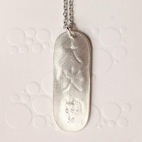 FROSTED DAI-KO-MYO PENDANT | < Z-FFIRE.COM > The Master Reiki Symbol Dai Ko Myo can help balance out energies carried through inherited memory and work on cellular levels. The Dai Ko Myo symbol is composed of three kanji's or characters and has the meaning of "great bright light" or "great shining light." The symbol represents empowerment: intuition, creativity, and spiritual connection.  .950 Pure Silver Dai Ko Myo Pendant 1.5" Length 0.5" Width < 4 cm Length < 1.5 cm Width