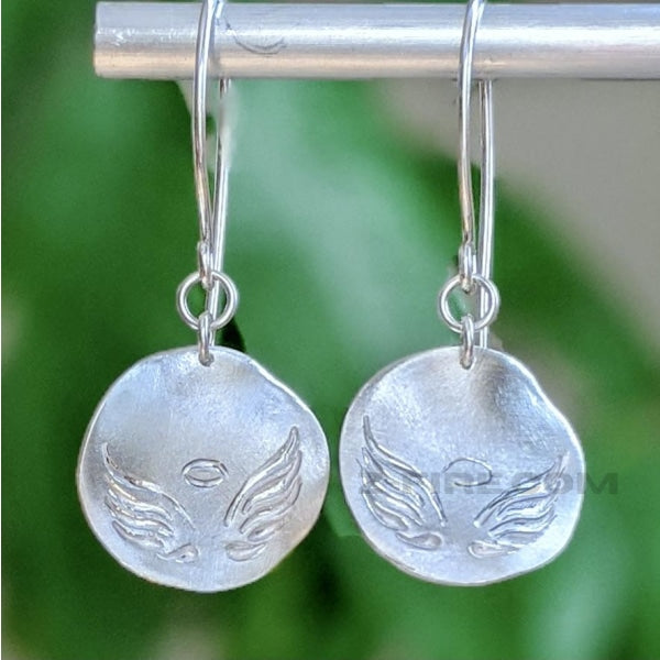 FROSTED ANGEL WINGS EARRINGS | <Z-FIRE.COM> Winged creatures are often messengers of the gods, and they are a symbol of freedom and spirituality. Angels also symbolize protection, affection, and harmony. Enjoy your wings ! 😇 .999 Fine Silver Angel Wings Earrings .925 Sterling Silver Ear Wires 6/8" Diameter About 2 cm Diameter About 2" Total Length About 5 cm Total Length Free Astrological Report of Choice Free Standard Shipping Hassle Free Returns