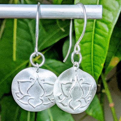 FROSTED LOTUS EARRINGS | <Z-FIRE.COM> Wear these Lotus Flower earrings as a symbol of purity, enlightenment, self-regeneration and rebirth. .999 Fine Silver Lotus Earrings .925 Sterling Silver Ear Wires 7/8" Diameter About 2 cm Diameter About 2" Total Length About 5 cm Total Length Free Astrological Report of Choice Free Standard Shipping Hassle Free Returns