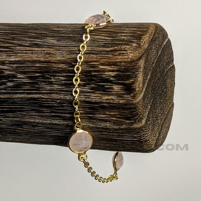 ROSE QUARTZ & GOLDEN CHAIN BRACELET | <Z-FIRE.COM> Rose quartz is often called the "Love Stone." The energetic hallmark of it is that of unconditional love that opens the heart chakra. As a variety of quartz, rose quartz has been long thought to be with high energy, and this intense energy possibly enhances love in virtually any situation 3 x 8mm Rose Quartz Components 24K Gold plated Sterling Silver Chain Size 7" Free Astrological Chart Free Shipping Hassle Free Returns