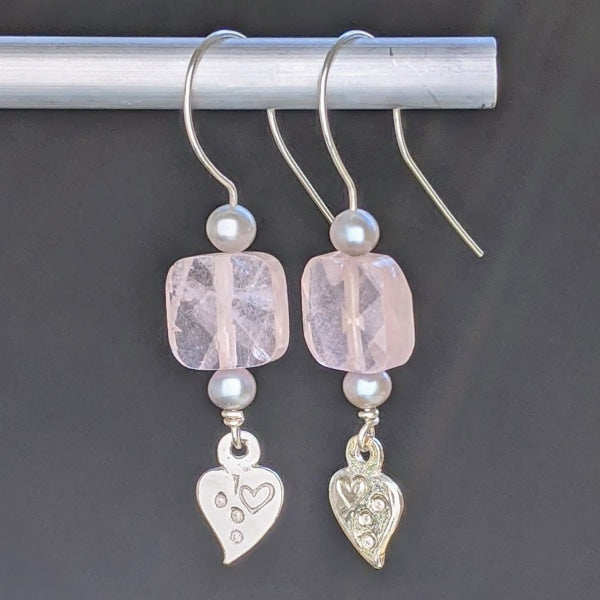 ROSE QUARTZ/GREY PEARLS SILVER EARRINGS | < Z-FIRE.COM > Free Standard Shipping Free Astrological Report of Choice Hassle Free Returns .999 Fine Silver Hearts .925 Sterling Silver Kidney Wires Rose Quartz 10mm Faceted Square Bead Grey Fresh Water Pearls About 3/8 Inches wide 1 cm wide About 1" 7/8 Total Length About 4.5 cm Total Length Hassle Free Returns